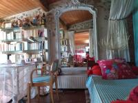 a bedroom with a mirror and a bed and a table at Riverside Home Cottage in Trèbes