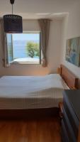 Postel nebo postele na pokoji v ubytování Beachfront Apartmant Veli Novi Vinodolski