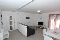 Televízia a/alebo spoločenská miestnosť v ubytovaní Apartments Polenta