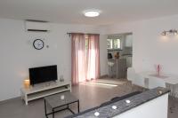 Televízia a/alebo spoločenská miestnosť v ubytovaní Apartments Polenta