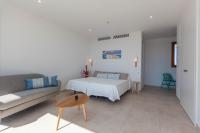 Łóżko lub łóżka w pokoju w obiekcie Apartamentos Villa Primera