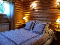 Postelja oz. postelje v sobi nastanitve CHALET SCANDINAVE ALASKAN class&eacute; 4 ETOILES