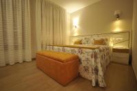 Posteľ alebo postele v izbe v ubytovaní Apartamentos Playa Compostela