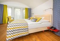 Postel nebo postele na pokoji v ubytování Bellevue Hotel Benešov