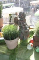 a statue of a little girl sitting on a table at Adam & Eva Gasthof Paradies mit Hotel in Vogt