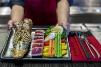 a tray of food with a lobster and vegetables at Anantara Rasananda Koh Phangan Villas in Thong Nai Pan Noi