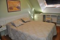 A bed or beds in a room at ATICO PINTOR ERNESTO GODAY