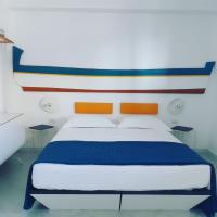 A bed or beds in a room at Hotel Pelaghea
