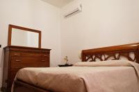 Łóżko lub łóżka w pokoju w obiekcie CASA TERRE BAROCCHE