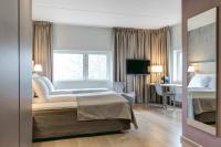 Postel nebo postele na pokoji v ubytování Quality Hotel Expo
