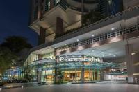 a building with a sign on the front of it at Chatrium Hotel Riverside Bangkok in Bangkok