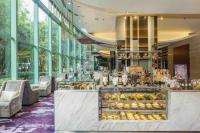 a bakery in a building with glass windows at Chatrium Hotel Riverside Bangkok in Bangkok
