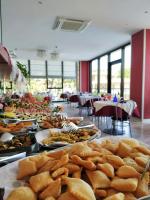 a buffet line with many different types of food at Hotel Prestigio in Cesenatico