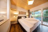 Ein Bett oder Betten in einem Zimmer der Unterkunft Hotel Post Krimml
