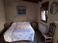 A bed or beds in a room at El Balcon de Peñafiel