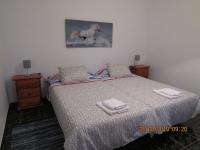 A bed or beds in a room at CASA EN LA PLAYA DE VALLEHERMOSO, ISLA DE LA GOMERA