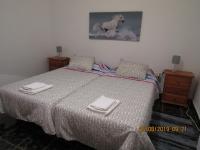 A bed or beds in a room at CASA EN LA PLAYA DE VALLEHERMOSO, ISLA DE LA GOMERA