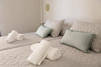 Posteľ alebo postele v izbe v ubytovaní Apartamentos Credencial