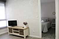 Televízia a/alebo spoločenská miestnosť v ubytovaní Apartamentos Credencial