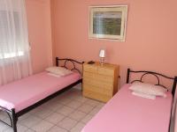 Postel nebo postele na pokoji v ubytování Socrates Apartments