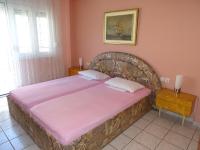 Postel nebo postele na pokoji v ubytování Socrates Apartments