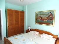 Postel nebo postele na pokoji v ubytování Socrates Apartments