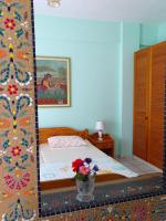 Postel nebo postele na pokoji v ubytování Socrates Apartments