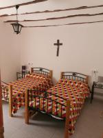A bed or beds in a room at Casa Rural y Albergue Tormon