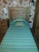 A bed or beds in a room at Posada de los Cónsules