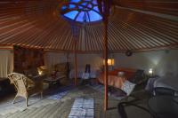 a bedroom with a large tent with a bed and a window at Xanadu Rural in Chiclana de la Frontera
