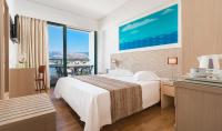 Posteľ alebo postele v izbe v ubytovaní Alexandra Hotel&Apartments
