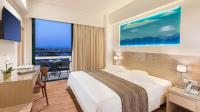 Posteľ alebo postele v izbe v ubytovaní Alexandra Hotel&Apartments