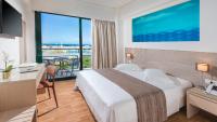 Posteľ alebo postele v izbe v ubytovaní Alexandra Hotel&Apartments
