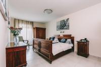 Posteľ alebo postele v izbe v ubytovaní Villa Georgina