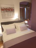 Posteľ alebo postele v izbe v ubytovaní Apartments and Rooms Villa Lina