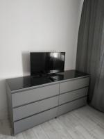 Televízia a/alebo spoločenská miestnosť v ubytovaní Apartament No 23