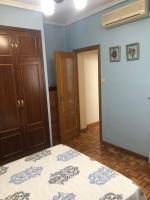Posteľ alebo postele v izbe v ubytovaní Apartamentos Puerta del Sol