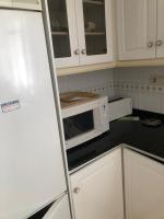 Kuchyňa alebo kuchynka v ubytovaní Apartamentos Puerta del Sol