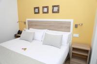 A bed or beds in a room at New Point Opera