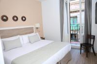 A bed or beds in a room at New Point Opera