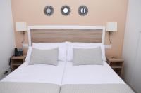 A bed or beds in a room at New Point Opera