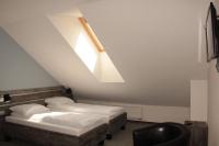 Łóżko lub łóżka w pokoju w obiekcie Hotel Giżycko