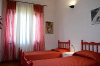 A bed or beds in a room at Villa Orrì