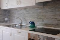A kitchen or kitchenette at Villa Orrì