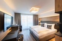 Posteľ alebo postele v izbe v ubytovaní Hotel Modern Mountain