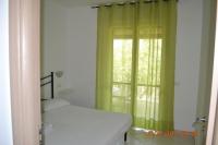 A bed or beds in a room at Oasi Peppa