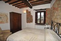 Posteľ alebo postele v izbe v ubytovaní La Casa nel Castello di Gaiche