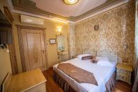 Postel nebo postele na pokoji v ubytování Kaftan Hotel