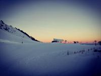 a snow covered slope with a ski lift in the distance at Plagne AIME 2000 Ski Apartments in Aime-La Plagne