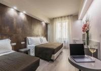 A bed or beds in a room at Astoria Deluxe rooms